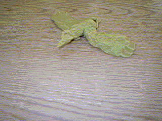 The photograph shows a green buzzard sculpture.
