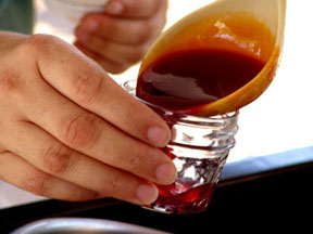 Pouring syrup into jar